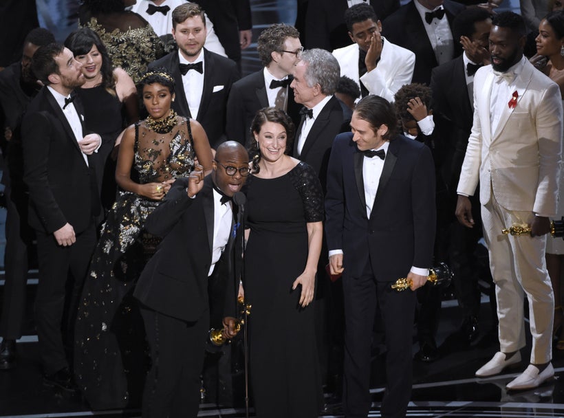 <em>Barry Jenkins, foreground left, and the cast accept the award for best picture for "Moonlight" at the Oscars on