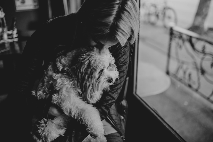 Theresa pictured with her angel puppy Waffles; Photo credit: Amber Mae Bailey Photography