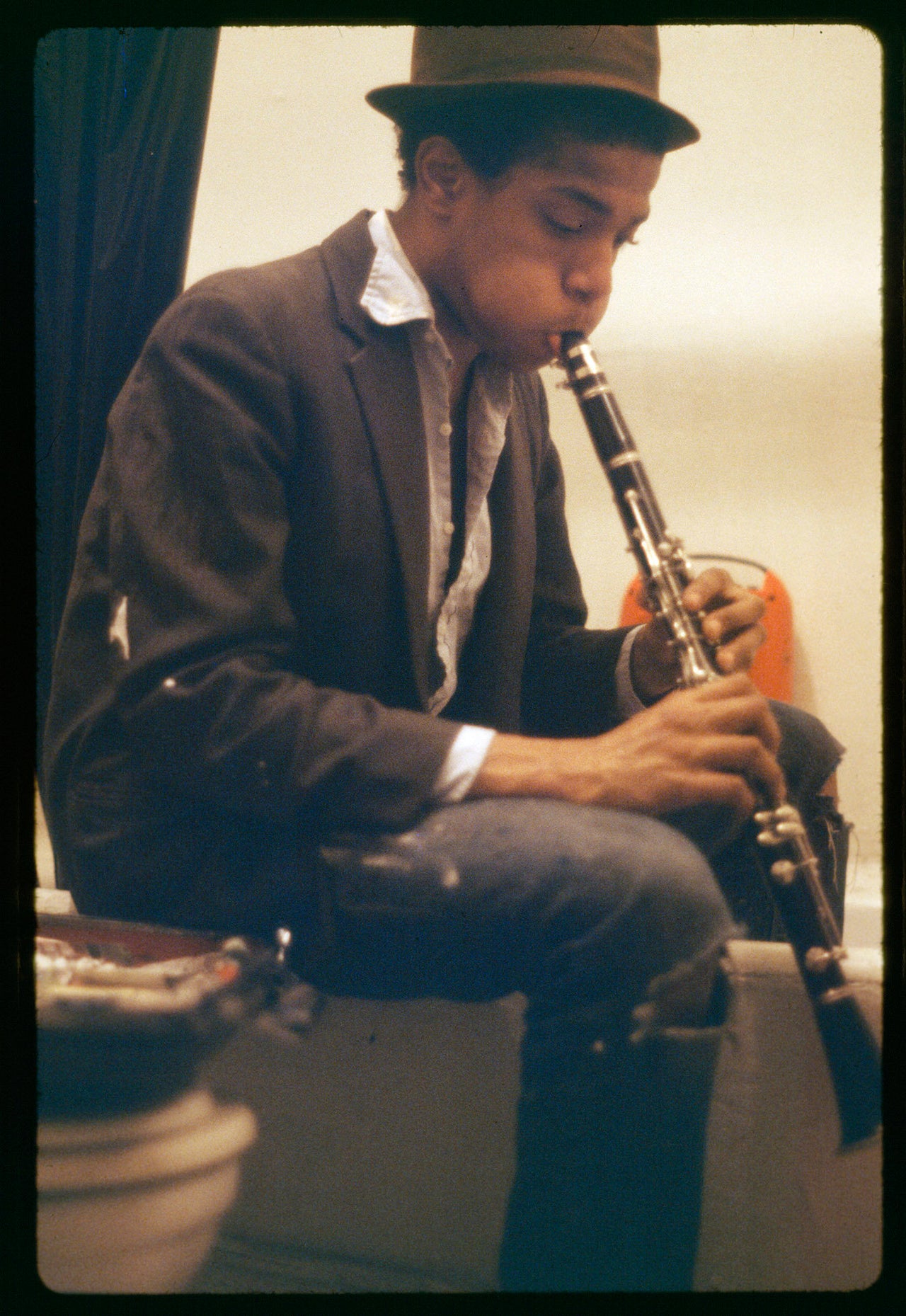 Basquiat practicing clarinet in the bathroom of the apartment, 1980.