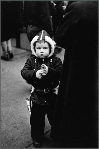 Kid in a hooded jacket aiming a gun, N.Y.C., 1957.