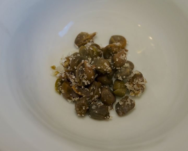 Salt-packed capers before rinsing and roughly chopping