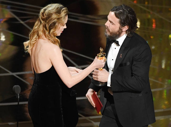 Brie Larson, who portrayed a rape survivor in <em>Room</em>, hands this year’s Best Actor Oscar to accused sexual harasser Ca