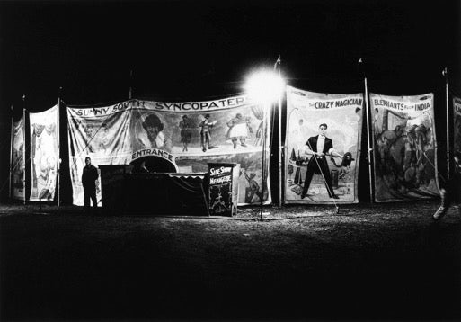 Sunny South Syncopaters and other sideshow banners at night, Palisades Park, N.J. 1957.