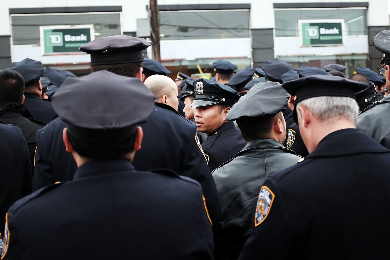 Police officers from across the country attend a funeral service for slain New York City Officer Wenjian Liu on Jan. 4, 2015.