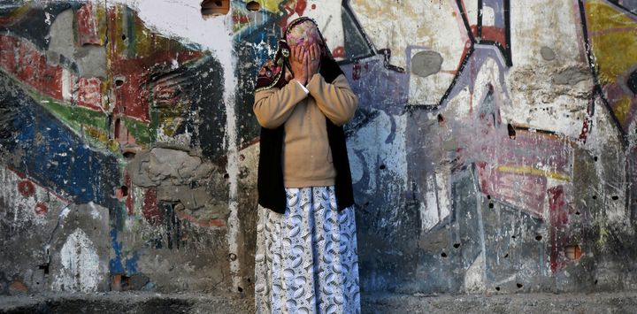 A woman reacts after a blast in the Kurdish-dominated southeastern city of Diyarbakir, November 4, 2016.
