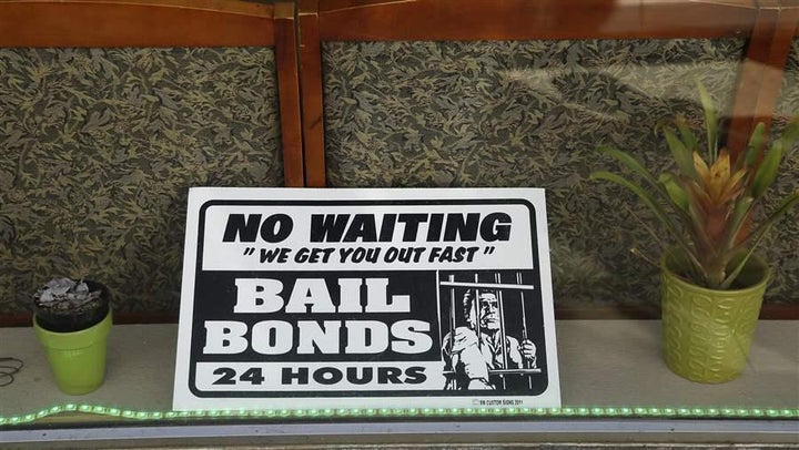 A sign in the window of a bail bonds office across from the Hall of Justice in San Francisco. Increasingly, states are reevaluating the purpose of cash bail and are making big changes to the practice.