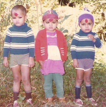 <p>A young Kalpana (middle) with two of her cousins.</p>
