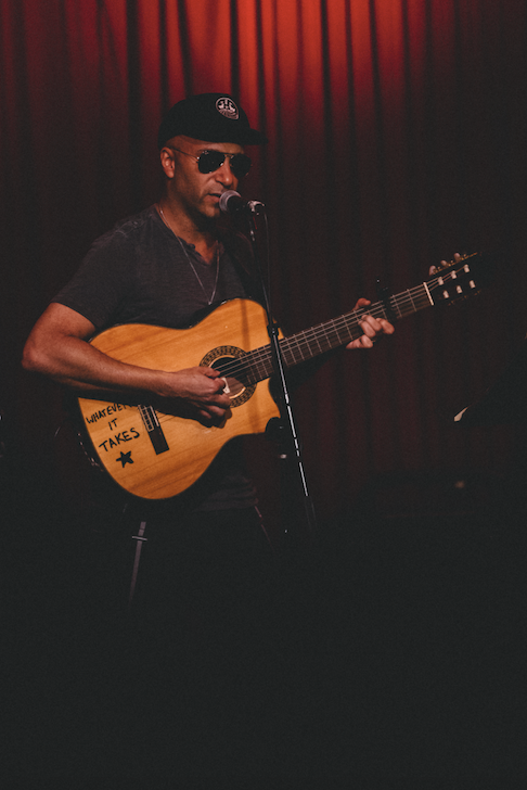 <p>Tom Morello sings folk songs on an acoustic guitar at Hotel Cafe on February 23, 2017. His label, Firebrand Records, promotes artists with a political voice. </p>
