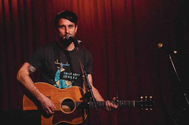 <p>Ryan Harvey performs at Hotel Cafe in Los Angeles on February 23, 2017. His volunteer travels in Greece have connected him to a network of activist musicians globally. </p>