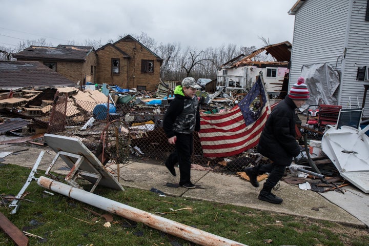 Ryan Chamberlain, 11, right, and Jacob Vogel, 12, on Wednesday, March 1, 2017 pass by the house of Jerry Nanouski, which was