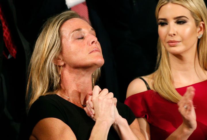 Carryn Owens, widow of Senior Chief Petty Officer William "Ryan" Owens, applauds with Ivanka Trump (R), daughter of U.S. President Donald Trump, after being mentioned by President Trump.