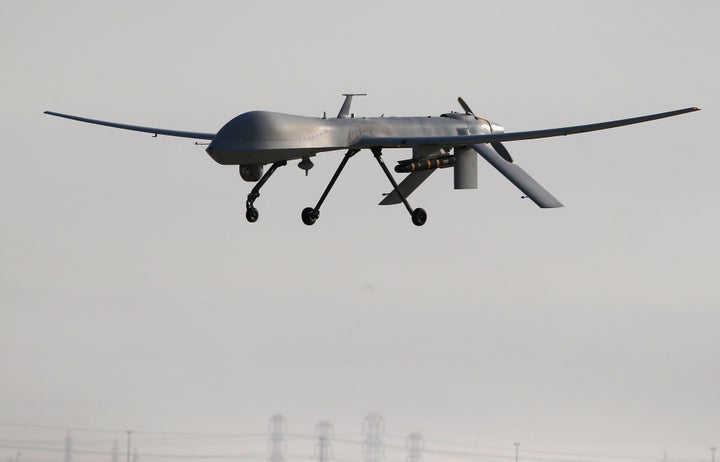 A U.S. Air Force MQ-1B Predator unmanned aerial vehicle (UAV), carrying a Hellfire missile lands at a secret air base after flying a mission in the Persian Gulf region on January 7, 2016.