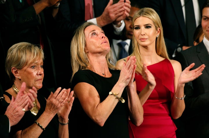 Carryn Owens, widow of William "Ryan" Owens, reacts after being mentioned by President Donald Trump as he delivers his f