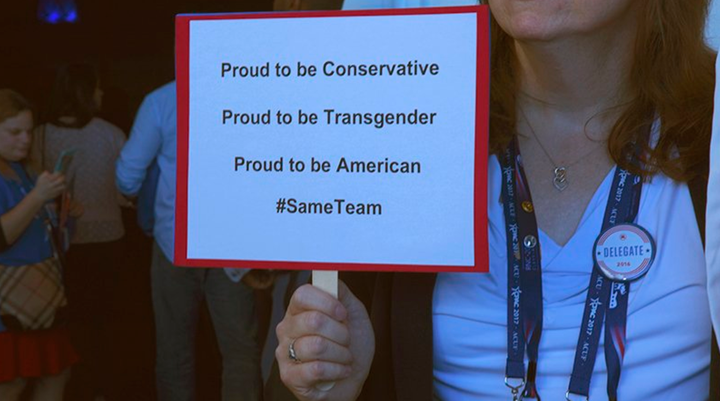 Jennifer Williams of Massachusetts holding a sign, standing outside the main ballroom at the Conservative Political Action Conference in National Harbor, Maryland last weekend