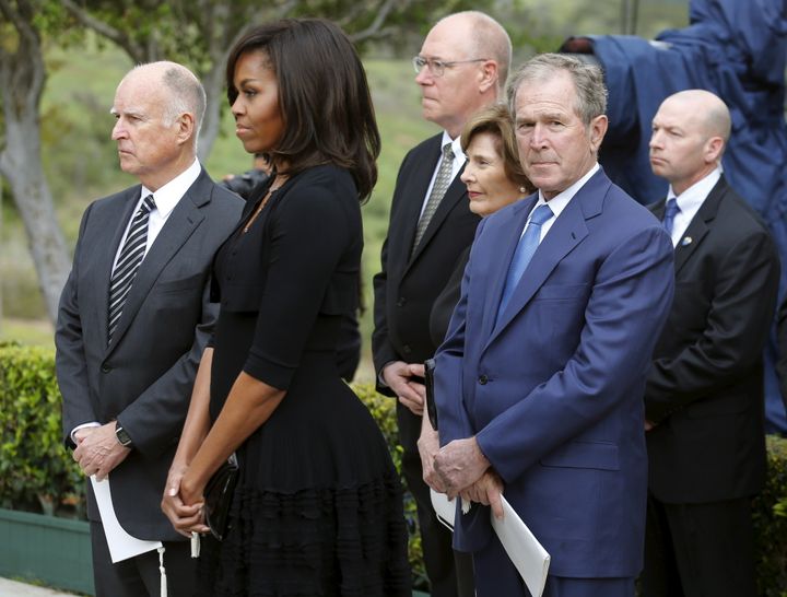 Bush and his wife, Laura, wait to pay their respects with Obama and California Governor, Jerry Brown, during the funeral for former first lady Nancy Reagan in March 2016.