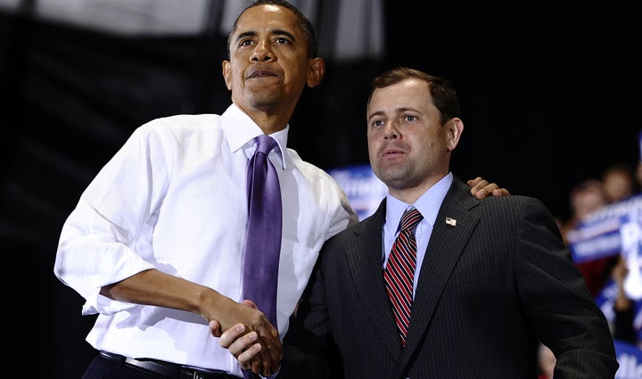 President Barack Obama shakes hands with Rep. Tom Perriello (D-Va.) at a rally in Charlottesville on Oct. 29, 2010, days befo