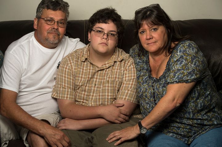 Gavin Grimm, the teenage plaintiff in a major transgender rights case, poses with parents David and Deirdre Grimm last year.