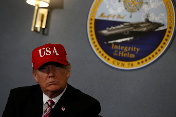 U.S. President Donald Trump gets a briefing before he tours the pre-commissioned U.S. Navy aircraft carrier Gerald R. Ford at Huntington Ingalls Newport News Shipbuilding facilities in Newport News, Virginia, U.S. March 2, 2017. (REUTERS/Jonathan Ernst)