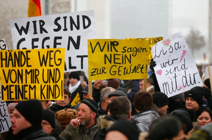 Members of the International Convention of German Russians in Berlin, Germany, demonstrate on Jan. 23, 2016, in the wake of false claims that immigrants raped a girl identified as Lisa. One sign reads "Lisa, we are with you."