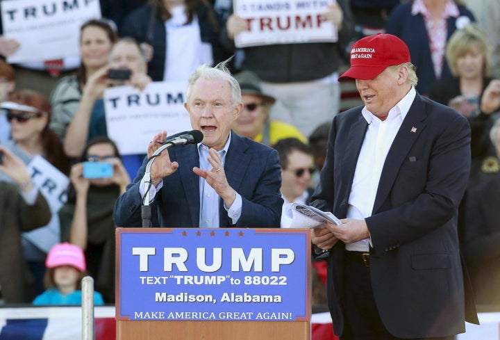 U.S. Senator Jeff Sessions speaks next to U.S. Republican presidential candidate Donald Trump at a rally at Madison City Schools Stadium in Madison, Alabama February 28, 2016