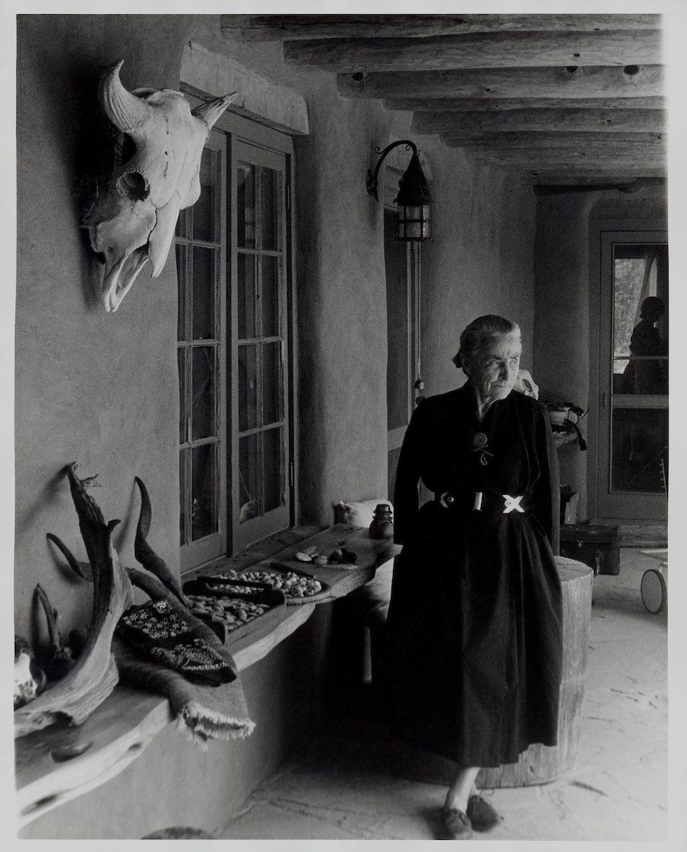 Todd Webb, portrait of Georgia O’Keeffe on Ghost Ranch Portal, New Mexico, circa 1960s, gelatin silver print, 10 by 8 inches (25.4 by 20.3 centimeters).