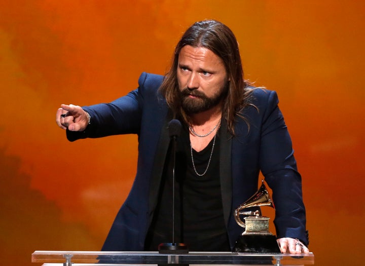 Max Martin, pop songwriter extraordinaire, points at something at the 2015 Grammy Awards.