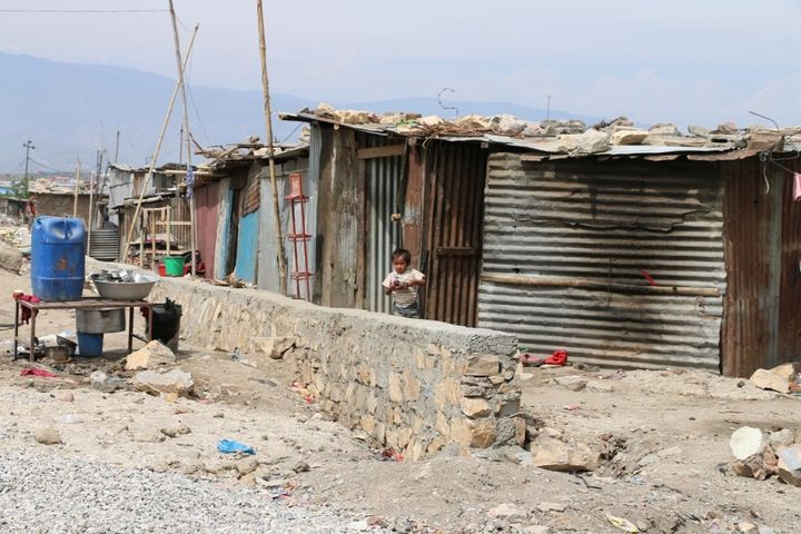 Sumina Pariyar and her family live in this row of corrugated tin shacks in Kathmandu. She says the dust and pollution have led to her baby’s respiratory problems.