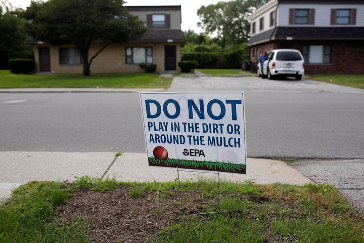 A sign requests that residents keep from playing in the dirt or mulch at the West Calumet Housing Complex in East Chicago, Indiana. The soil contains high levels of lead and arsenic.