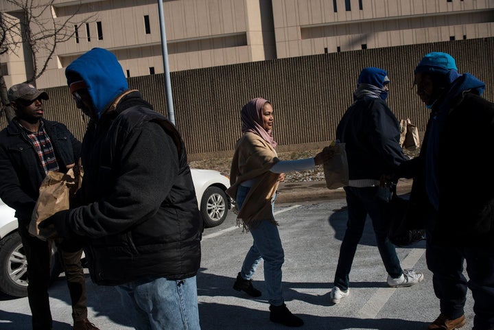 Lyric Harris distributing meals to the homeless in Baltimore with her husband, a Chad-born American citizen who is now an ROTC cadet.