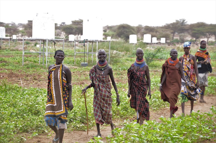 <p><em>Small holder farmers patrolling their plots in Napuu I Drip Irrigation scheme in Turkana. </em></p>