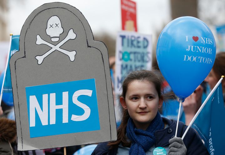 <strong>A demonstrator holds a balloon that reads 'I Love NHS Junior Doctors' during the protest</strong>