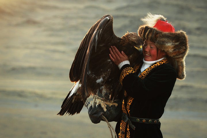 Aisholpan in full Kazakh uniform with golden eagle in Mongolia http://www.svidensky.com/projects/the-eagle-huntress