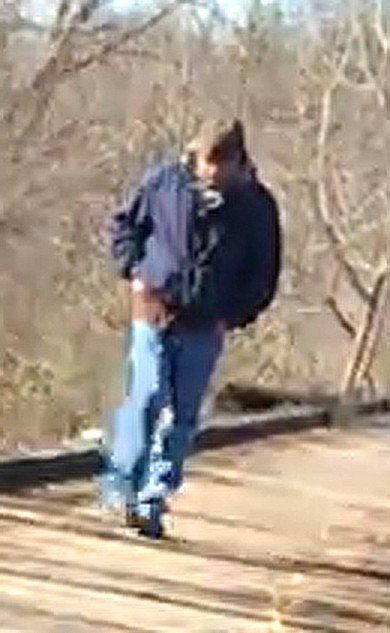 Police are hoping to identify and speak with this man, who was photographed by two girls before their deaths in the woods north of Indianapolis last month.