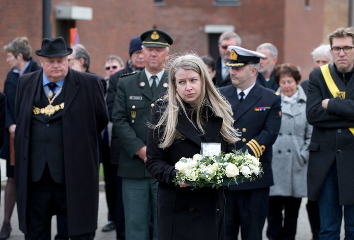 Kim Spooner with a floral tribute to her lost loved ones 