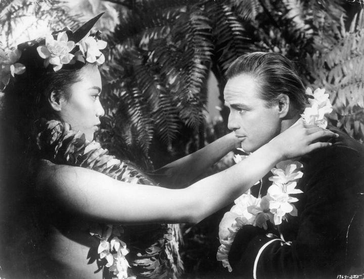 Marlon Brando receives a lei from a Tahitian woman in the 1962 film, in which he portrayed Fletcher Christian 