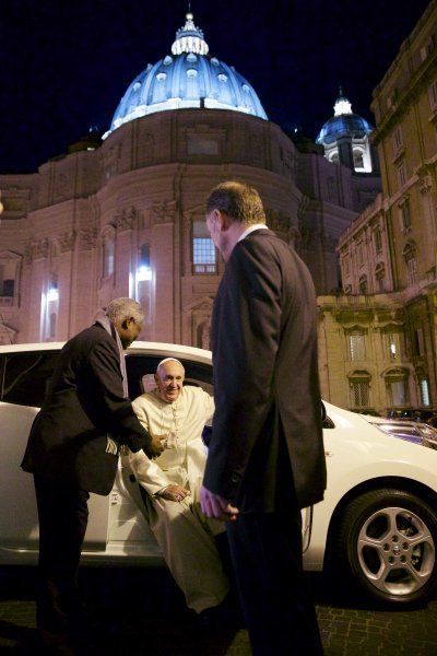 Pope Francis and his new electric car at the Vatican.