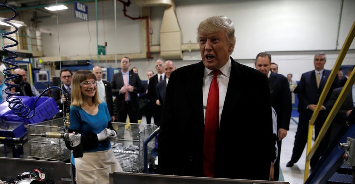 U.S. President-elect Donald Trump speaks to members of the news media as he tours a Carrier factory in Indianapolis, Indiana,