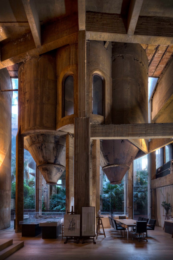 When Bofill purchased the factory, its <a href="http://www.ricardobofill.com/la-fabrica/read/" target="_blank">massive silos</a> were still full of cement.