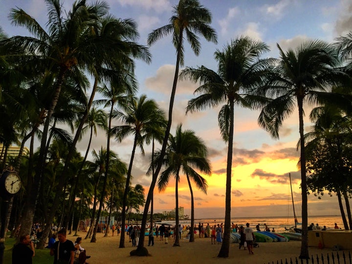 The sunsets at Waikiki are every bit as colorful as they would have been for Mark Twain.