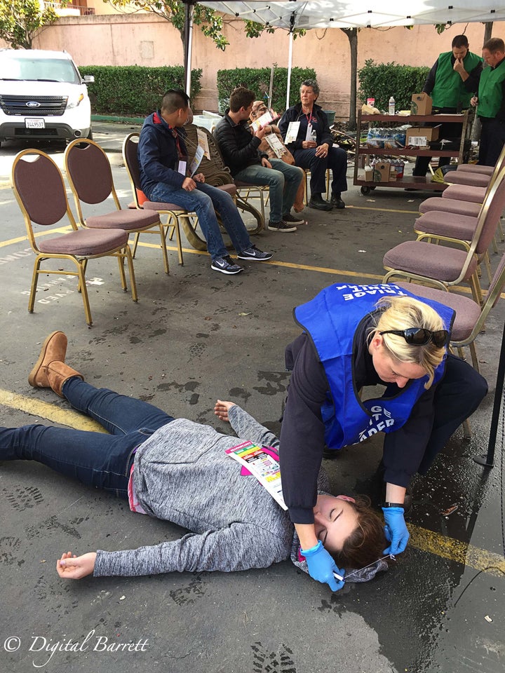 Students from the UC Davis Fire Department EMT program volunteered to be live patients for the MCI drill. Each volunteer was given a tag indicating their injuries. Once outside, they were assessed by waiting paramedics.