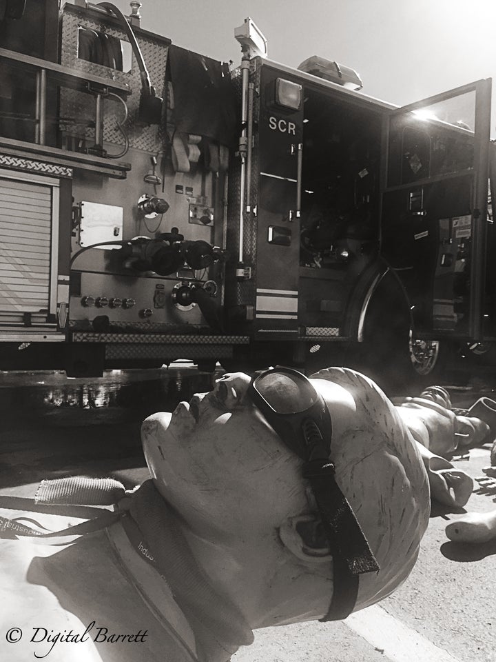 <p>One of the mannequins basks in the afternoon sun after being rescued from the smoke filled building.</p>