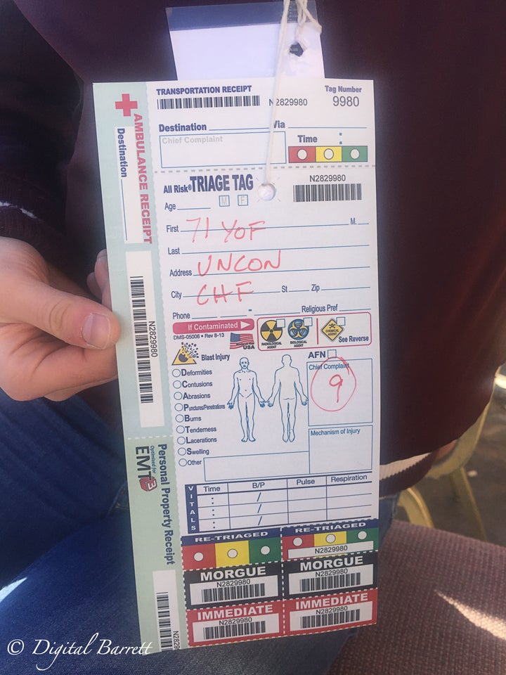 A triage tag for a 71 year old female who was unconscious and has a history of congestive heart failure.