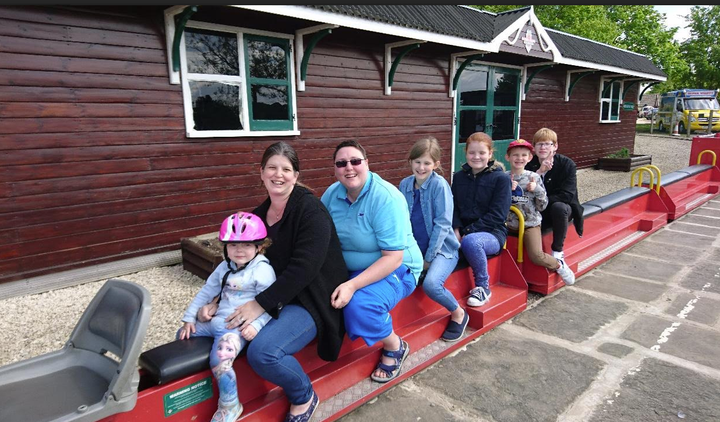 Kate Fruin-Smith and her wife Rebecca with their five children.