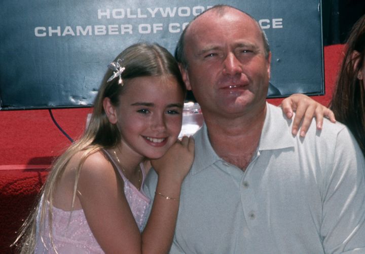 Lily Collins and Phil Collins in 1999.