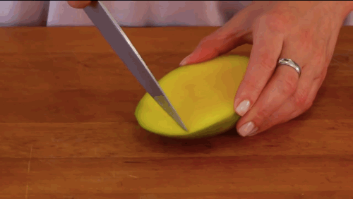 Scoring the fruit of a mango.
