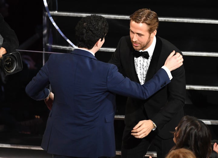 Director Damien Chazelle embraces actor Ryan Gosling after winning Best Director for "La La Land" during the 89th Oscars on Feb. 26, 2017.