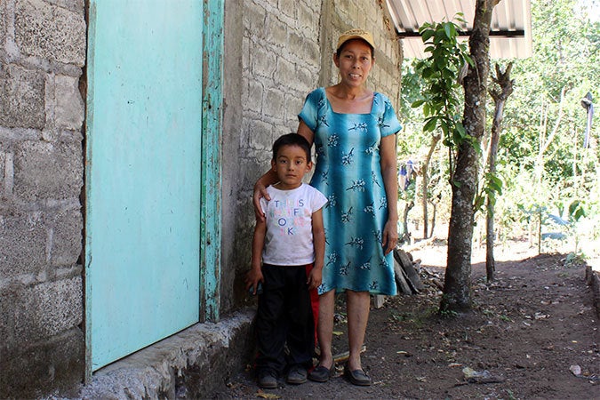  Mercedes Sanchez de Garcia with her youngest son. Photo: UN Women/Monika Remé