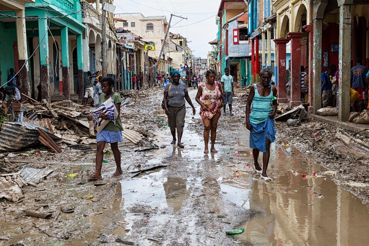 Residents in the Haitian city of Les Cayes on the streets two days after Hurricane Matthew, a category 4 storm, made landfall in the country on 4 October 2016.