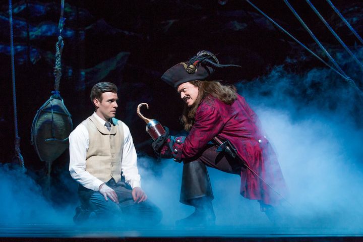 Billy Harrigan Tighe (as J.M. Barrie) and Tom Hewitt (as Captain Hook) in a scene from the National Tour of Finding Neverland
