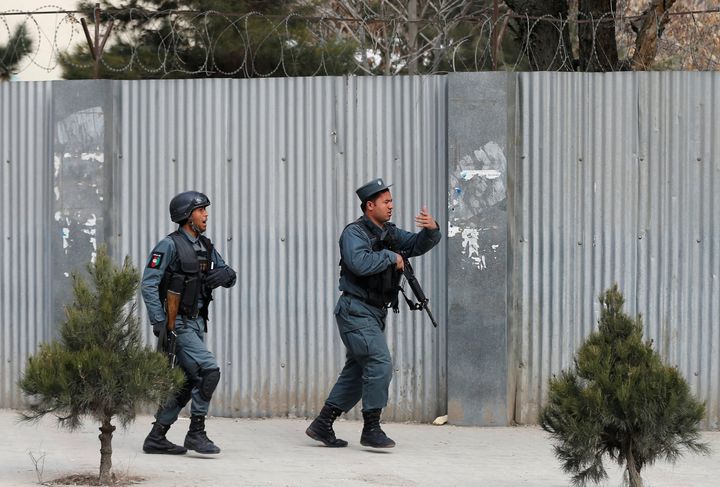 Afghan police arrive at the site of an attack on a military hospital in Kabul on Wednesday.